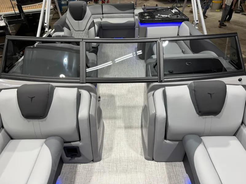 Slide: The Image of Interior of 2026 Tahoe LTZ 2385 Elite Tritoon with luxurious seating. - 31