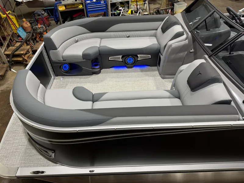 Slide: The Image of Interior of 2026 Tahoe LTZ 2385 Elite Tritoon with luxurious seating. - 2