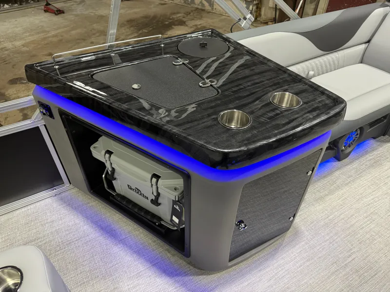 Slide: The Image of 2026 Tahoe LTZ 2385 Elite Tritoon interior with bar and cooler. - 21