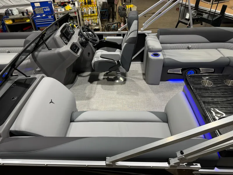 Slide: The Image of Interior of 2026 Tahoe LTZ 2385 Elite Tritoon with luxurious seating. - 4