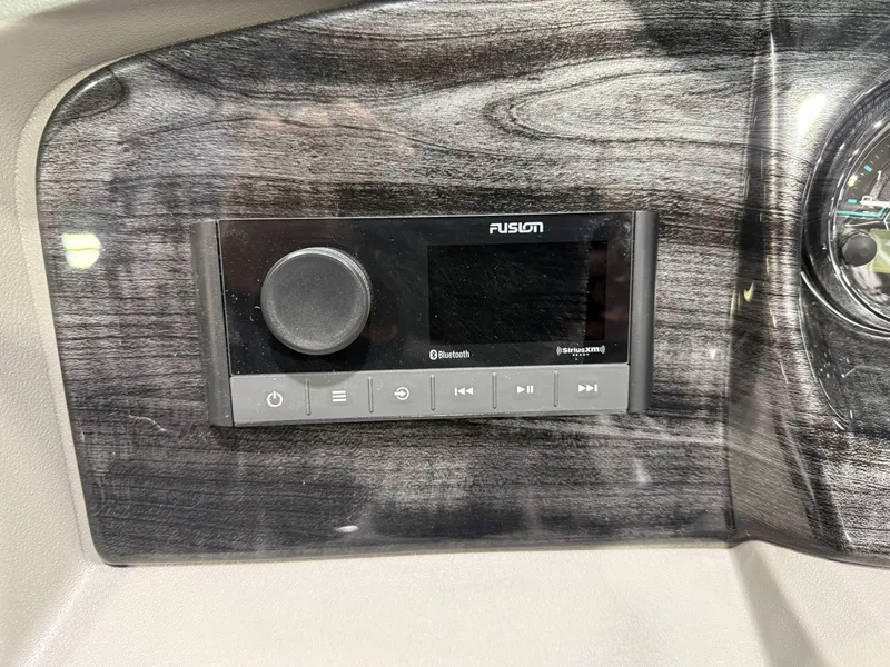 Slide: The Image of Fusion Bluetooth stereo system in 2026 Tahoe LTZ 2385 VRB 300HP Swingback. - 13