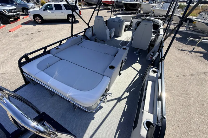Slide: The Image of 2026 Avalon 2385 LSZ Versatile Rear Bench Tri Toon boat interior with seating and helm. - 10
