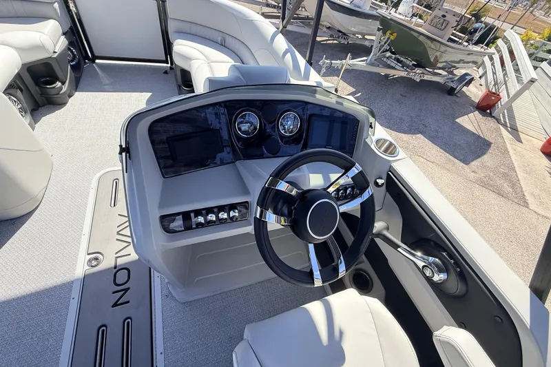 Slide: The Image of 2026 Avalon 2385 LSZ Versatile Rear Bench boat interior with modern steering console. - 24