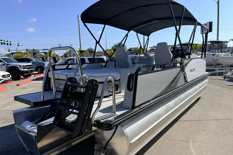 Slide: The Image of 2026 Avalon 2385 LSZ Versatile Rear Bench Tri Toon boat with high-performance features. - 6