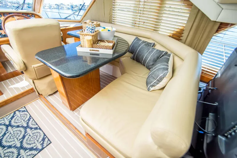 Slide: The Image of Luxurious interior of 2005 Navigator 4400 Pilothouse with plush seating and elegant table setting. - 11