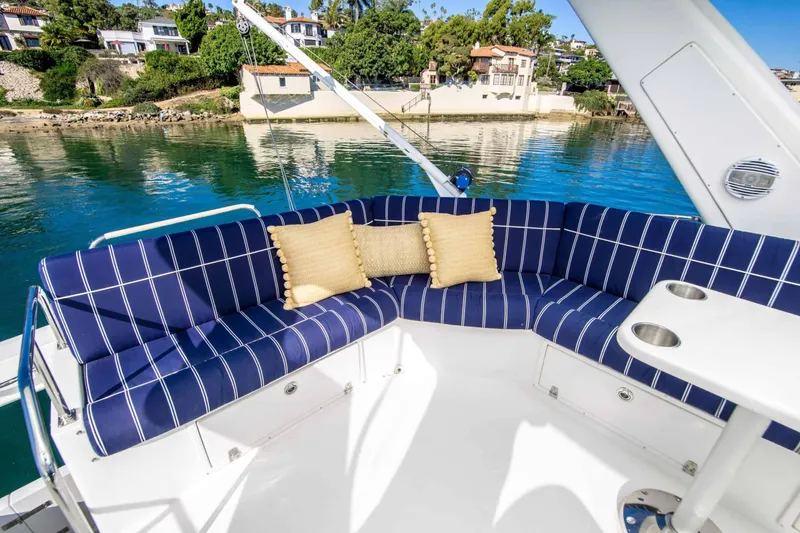 Slide: The Image of Luxurious seating area on 2005 Navigator 4400 Pilothouse yacht with scenic waterfront view. - 16