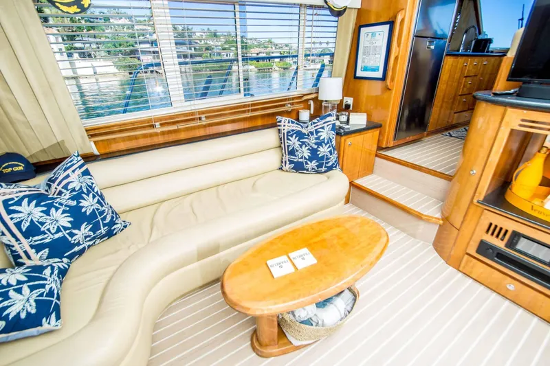 Slide: The Image of Luxurious interior of 2005 Navigator 4400 Pilothouse yacht with plush seating and nautical decor. - 3