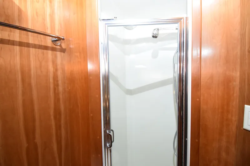 Slide: The Image of 2005 Navigator 4400 Pilothouse yacht docked at marina under clear blue sky. - 31