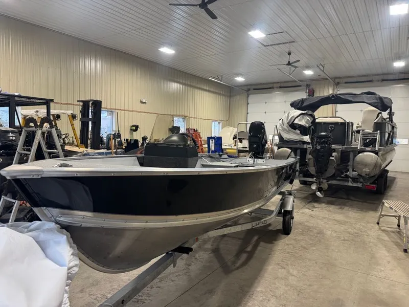 Slide: The Image of 2026 Lund SSV-18 boat stored in a workshop. - 5