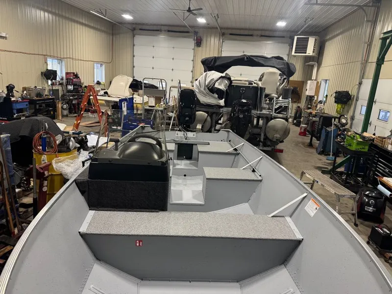 Slide: The Image of Lund SSV-18 2026 in a workshop with boating equipment. - 9