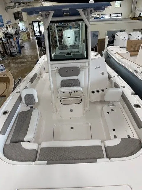 Slide: The Image of Interior view of 2024 Caymas 28 HB boat in showroom. - 4