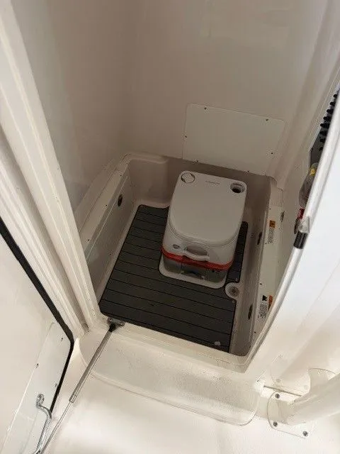 Slide: The Image of Interior of 2024 Caymas 28 HB with portable toilet. - 5