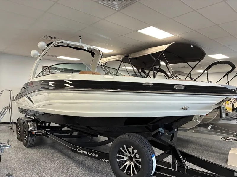 The Image of 2026 Crownline 288 SS boat in showroom on trailer. - 1