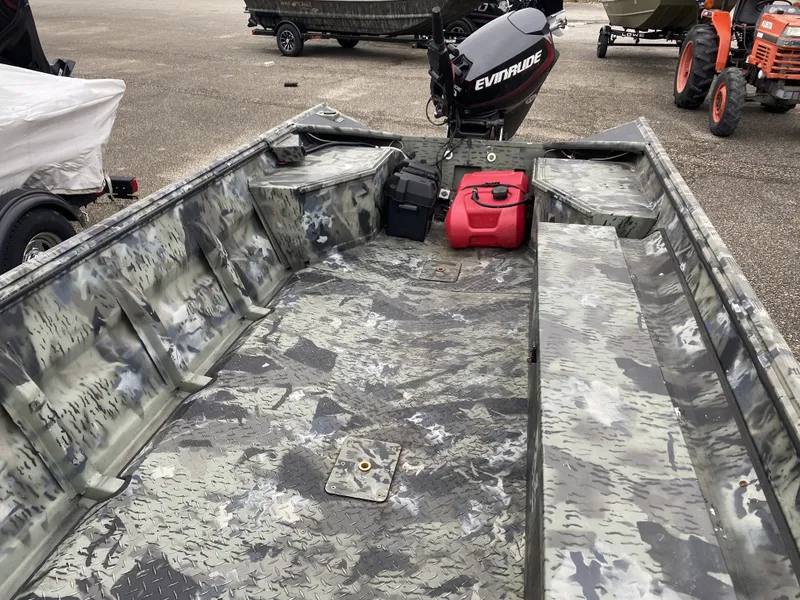 Slide: The Image of 2011 War Eagle 648LDV boat with Evinrude motor and camouflage pattern. - 5