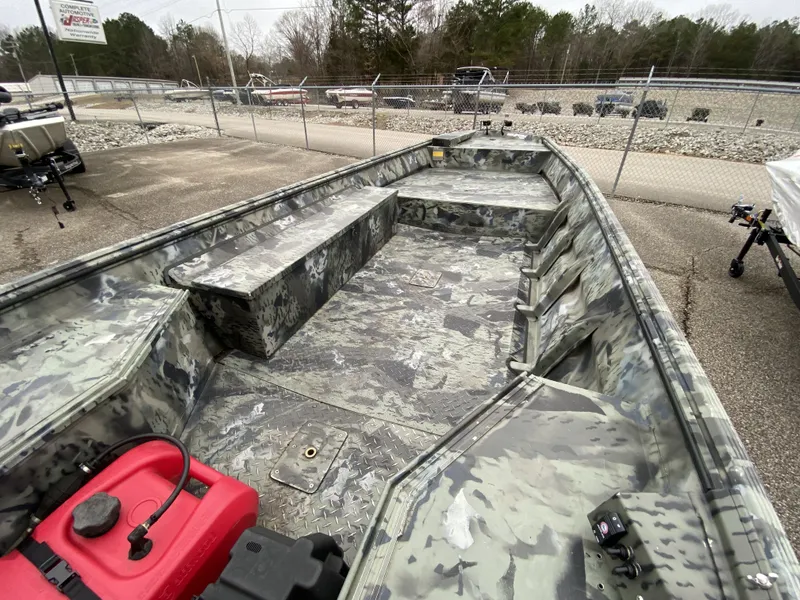 Slide: The Image of 2011 War Eagle 648LDV boat with camouflage design outdoors. - 6