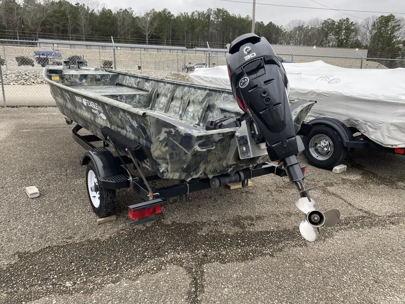 Slide: The Image of 2011 War Eagle 648LDV boat with outboard motor on trailer. - 7
