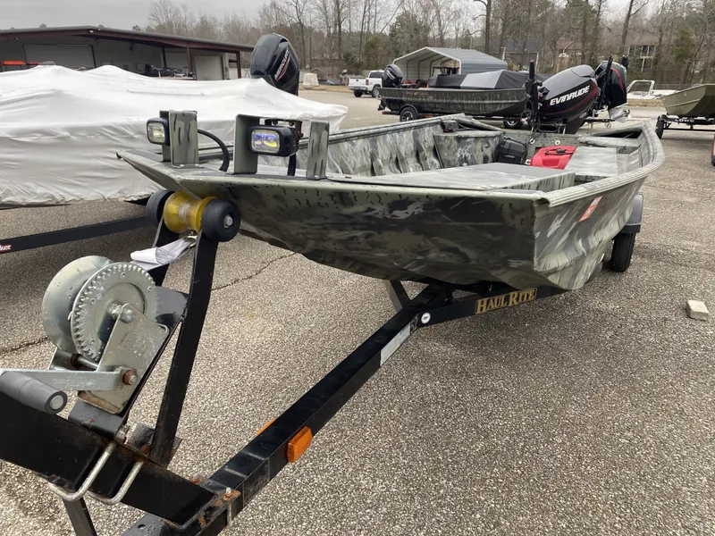 Slide: The Image of 2011 War Eagle 648LDV boat on trailer outdoors. - 9