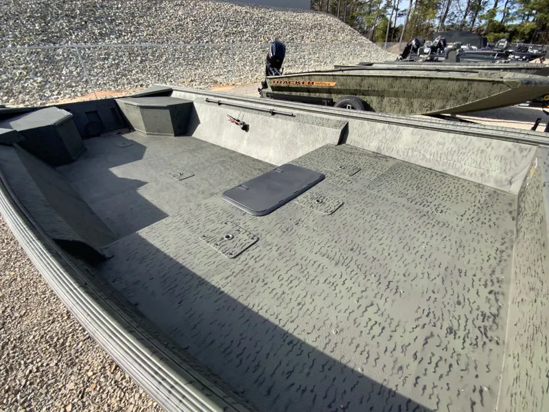 Slide: The Image of War Eagle 860LDV 2026 aluminum boat on gravel surface. - 4