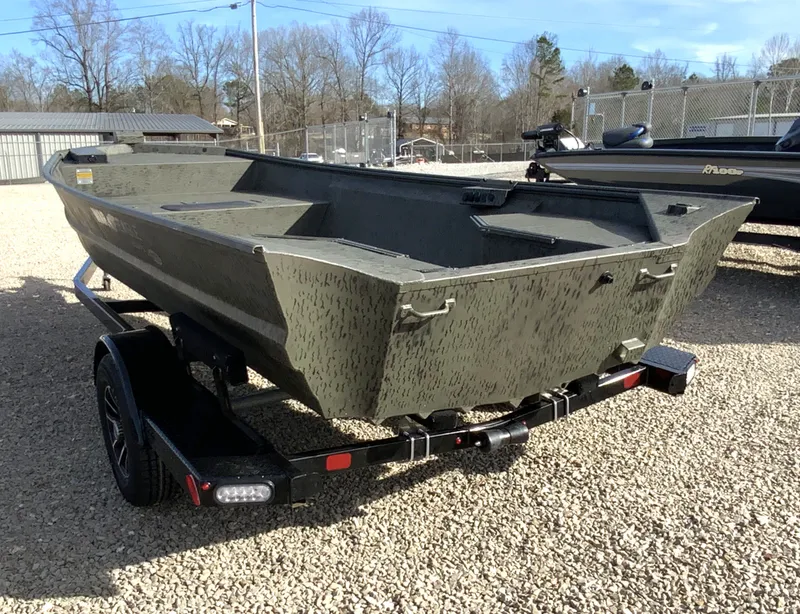 Slide: The Image of War Eagle 860LDV 2026 boat on trailer, parked outdoors. - 5