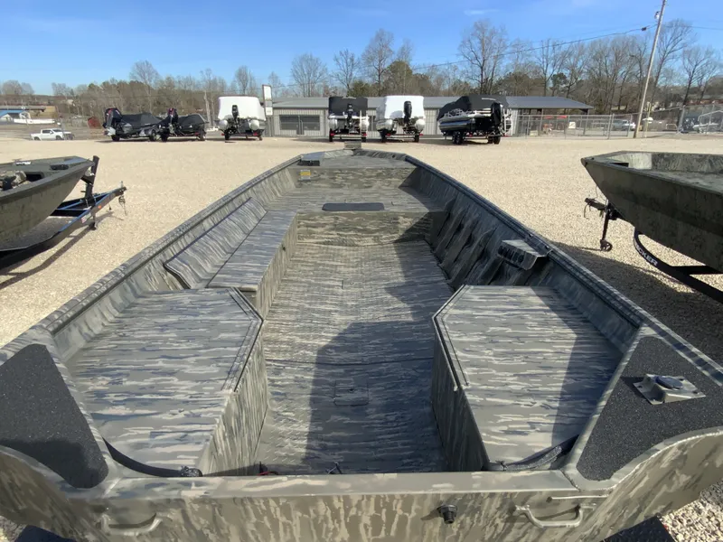 Slide: The Image of War Eagle 860LDV 2026 aluminum boat on gravel lot. - 7