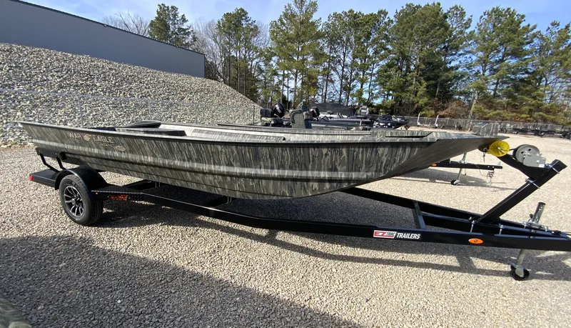Slide: The Image of 2026 War Eagle 860LDV boat on trailer outdoors. - 9