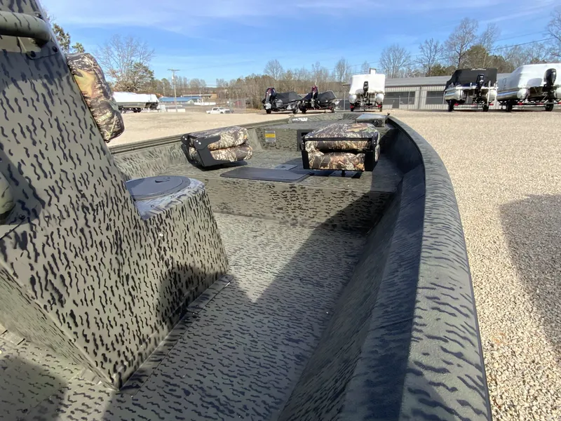 Slide: The Image of War Eagle 961BH CC 2026 boat with camouflage pattern and seating. - 10