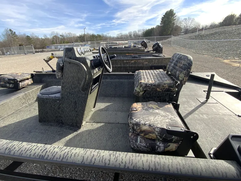 Slide: The Image of Interior view of War Eagle 961BH CC boat, model year 2026. - 12