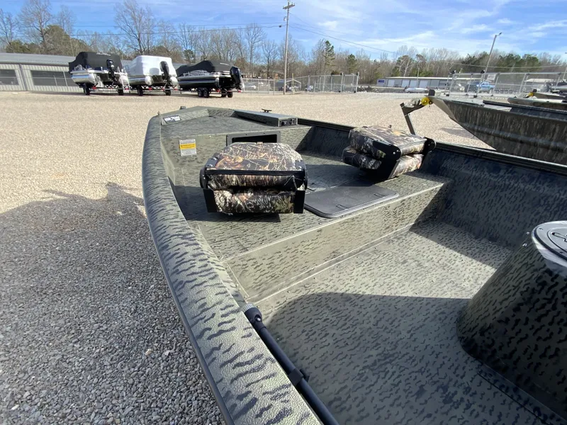 Slide: The Image of 2026 War Eagle 961BH CC boat with camouflage pattern on gravel lot. - 13