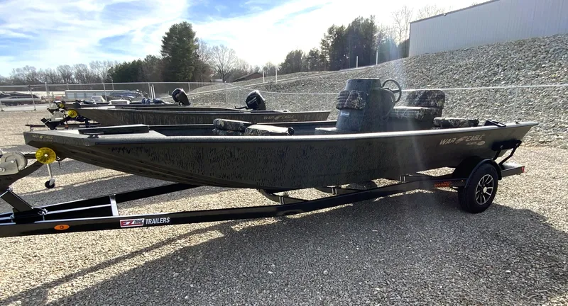 Slide: The Image of 2026 War Eagle 961BH CC boat on trailer outdoors. - 6