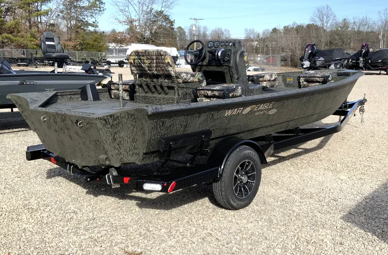Slide: The Image of 2026 War Eagle 961BH CC boat on trailer outdoors. - 8