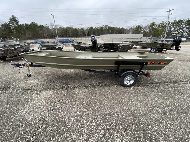 The Image of 2026 Tracker Grizzly 15 Jon boat on trailer outdoors. - 1