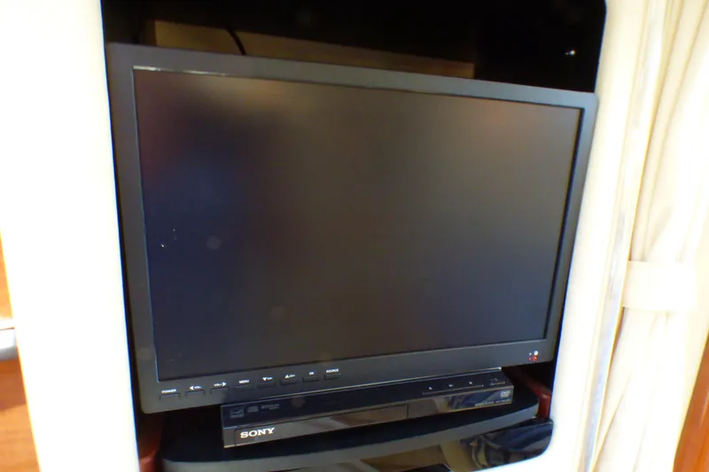 Slide: The Image of Sony TV and DVD player inside a 2002 Sea Ray 340 Sundancer yacht. - 13