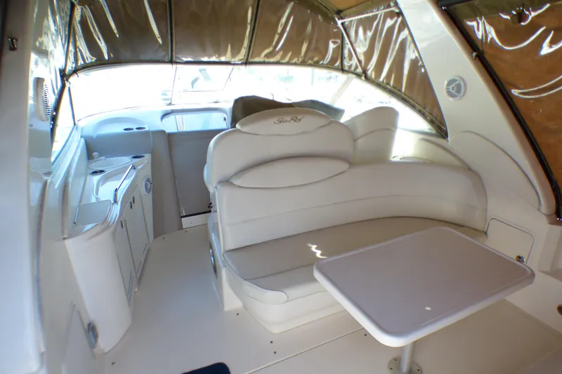 Slide: The Image of Interior of 2002 Sea Ray 340 Sundancer boat with white seating and table. - 20