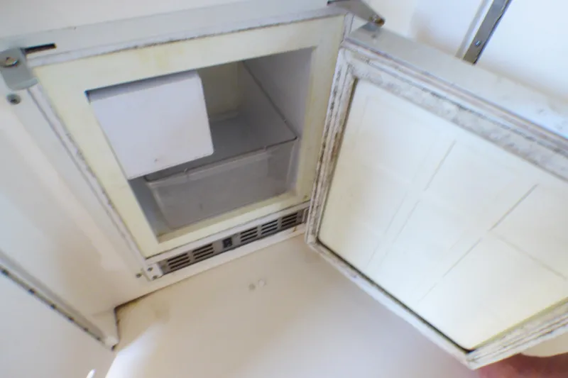 Slide: The Image of Open refrigerator compartment on 2002 Sea Ray 340 Sundancer boat. - 24