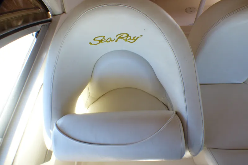 Slide: The Image of White leather seat with "Sea Ray" logo on a 2002 Sea Ray 340 Sundancer boat. - 29