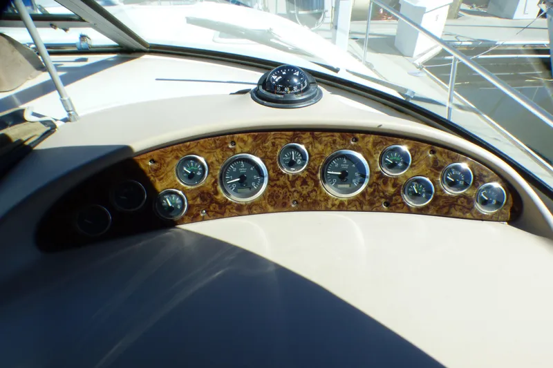 Slide: The Image of Dashboard of 2002 Sea Ray 340 Sundancer with gauges and compass. - 37