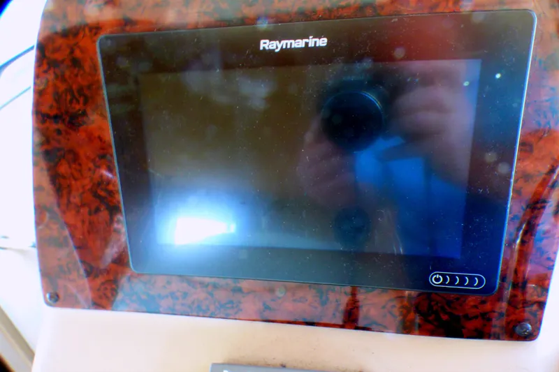 Slide: The Image of Raymarine display on 2002 Sea Ray 340 Sundancer boat dashboard. - 39