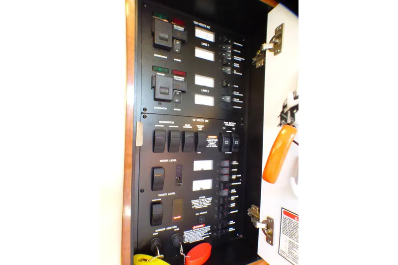 Slide: The Image of Electrical control panel on a 2002 Sea Ray 340 Sundancer boat. - 44