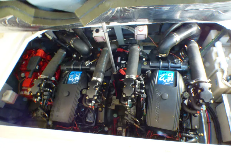 Slide: The Image of Engine compartment of a 2002 Sea Ray 340 Sundancer boat, showcasing dual engines. - 46