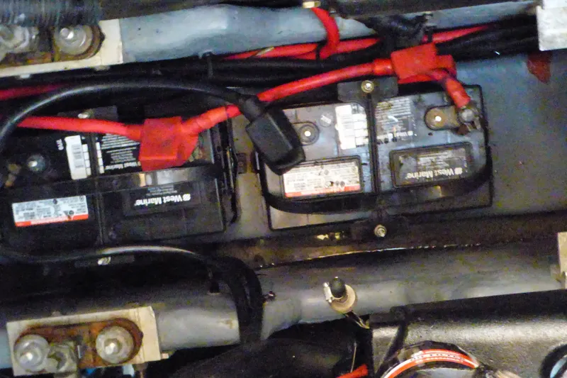 Slide: The Image of Battery compartment of a 2002 Sea Ray 340 Sundancer with visible wiring connections. - 50