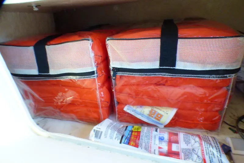 Slide: The Image of Life jackets stored on a 2002 Sea Ray 340 Sundancer boat. - 52