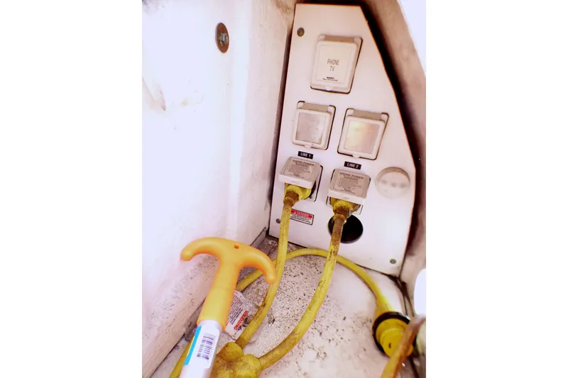 Slide: The Image of Electrical panel with yellow cables on a 2002 Sea Ray 340 Sundancer boat. - 54