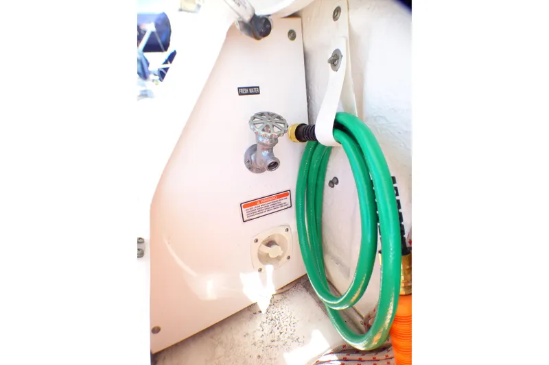 Slide: The Image of Freshwater hose connection on 2002 Sea Ray 340 Sundancer boat. - 55