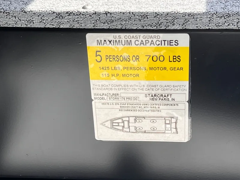 Slide: The Image of US Coast Guard capacity label on Starcraft Storm 176 DC Pro SE boat. - 7