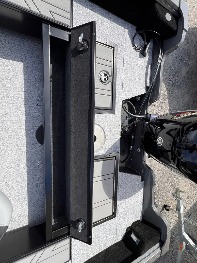 Slide: The Image of Starcraft Storm 176 DC Pro SE 2026 boat interior with motor. - 9