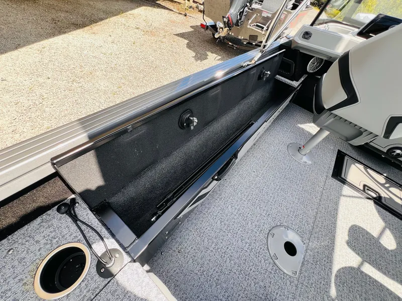 Slide: The Image of Interior of 2026 Starcraft Delta 178 DC boat with storage compartment. - 13