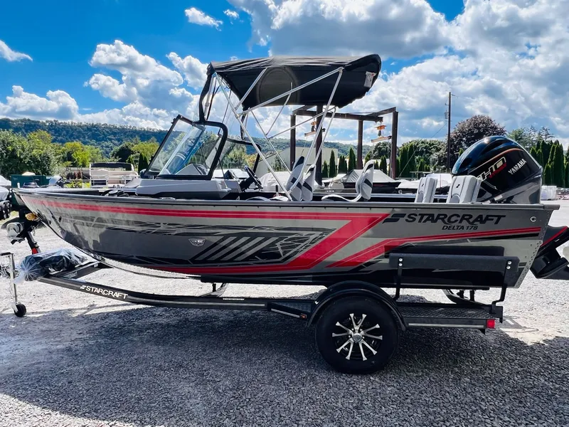 Slide: The Image of Starcraft Delta 178 DC 2026 boat on trailer, sunny day. - 18