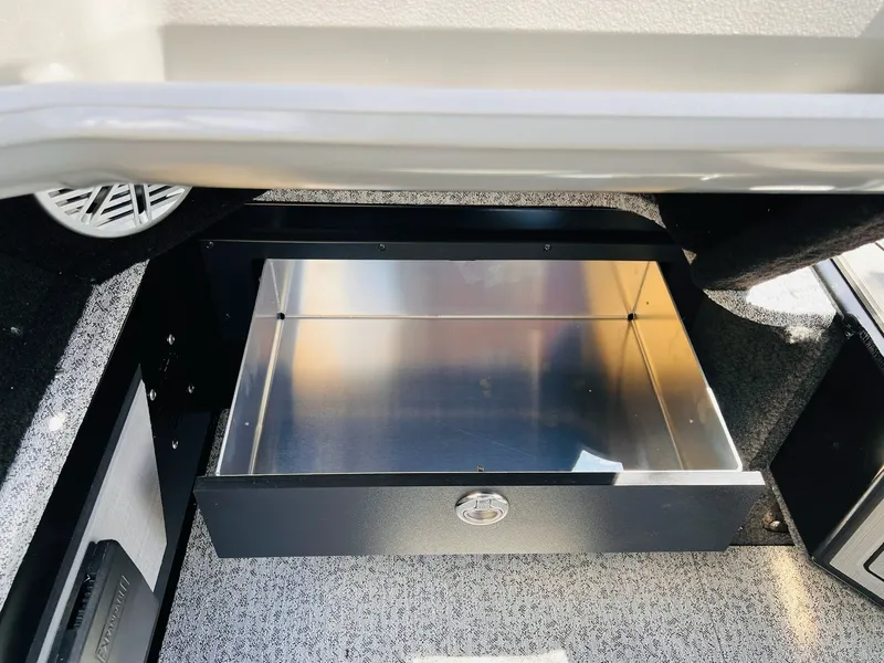 Slide: The Image of Open storage compartment in 2026 Starcraft Delta 178 DC boat. - 31