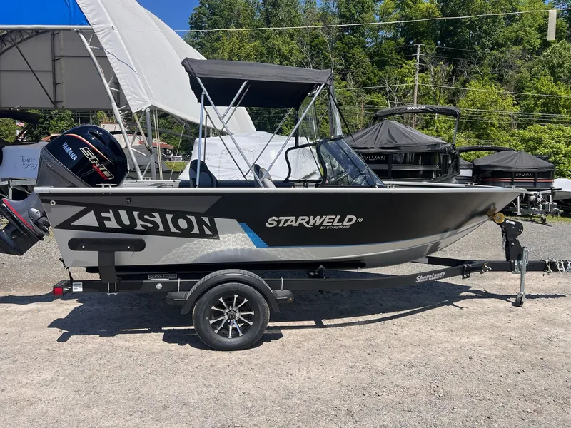 Slide: The Image of Starweld Fusion Pro 18 DC boat, 2026 model, on trailer. - 13