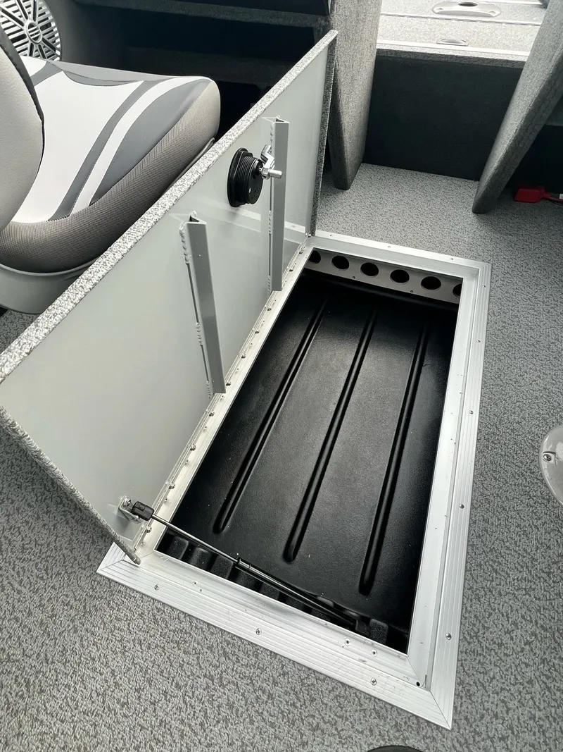 Slide: The Image of Open storage compartment in Starweld Fusion Pro 18 DC boat, 2026 model. - 18